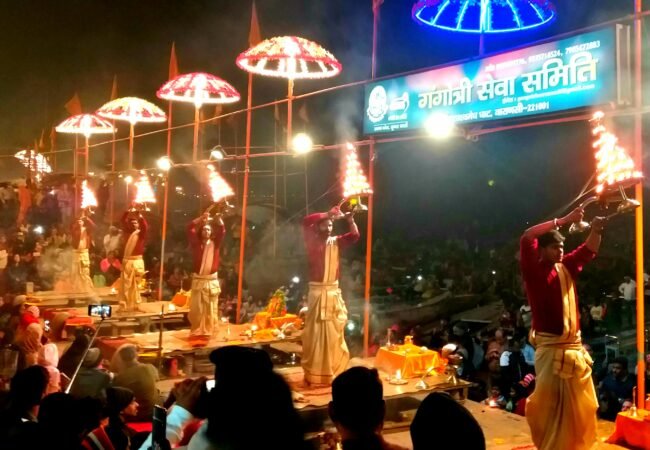 Priests performing evening Ganga Aarti at Dashashwamedh Ghat in Varanasi