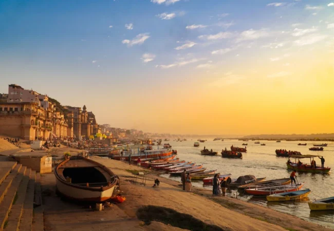 Varanasi ghats and boats on the Ganges during golden hour