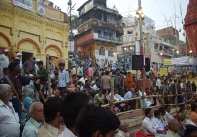 Families and visitors gathered on a Varanasi ghat during Dev Deepawali celebrations